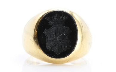 A gentlemen's gold and onyx set oval signet ring