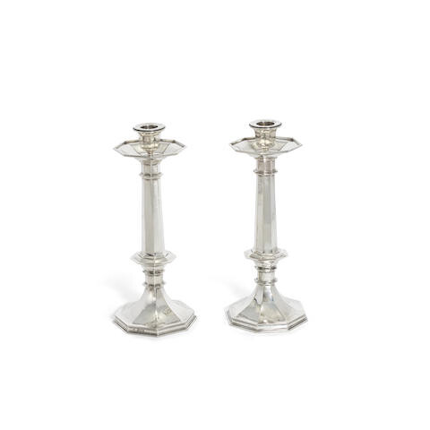 A large pair of silver candlesticks