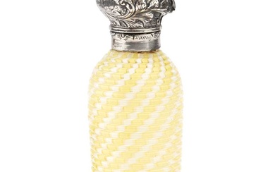 A late 19th century silver topped ridged glass scent bottle,...