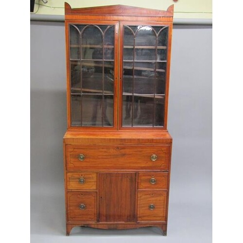 A late Georgian mahogany secretaire bookcase, the upper stru...