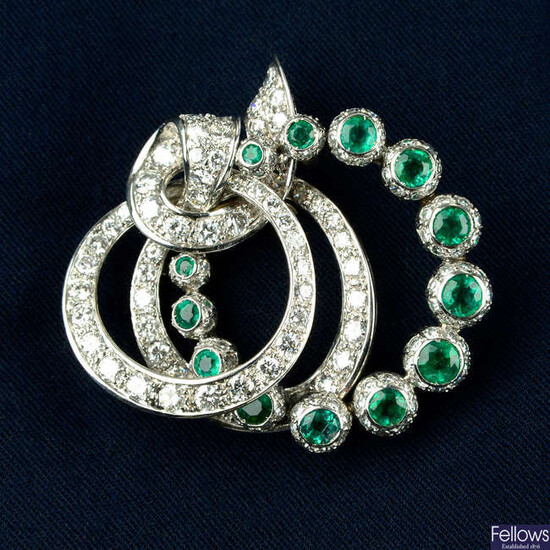 A mid 20th century platinum, emerald and vari-cut diamond brooch.