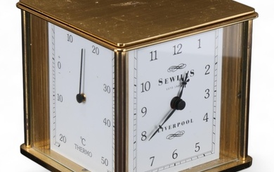 A modern 4-faced revolving desk clock, hygrometer, barometer...