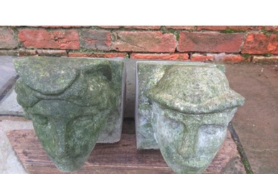 A pair of 19th century style cast stone corbels of a French ...