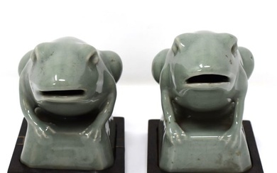 A pair of Chinese celadon glazed porcelain frogs