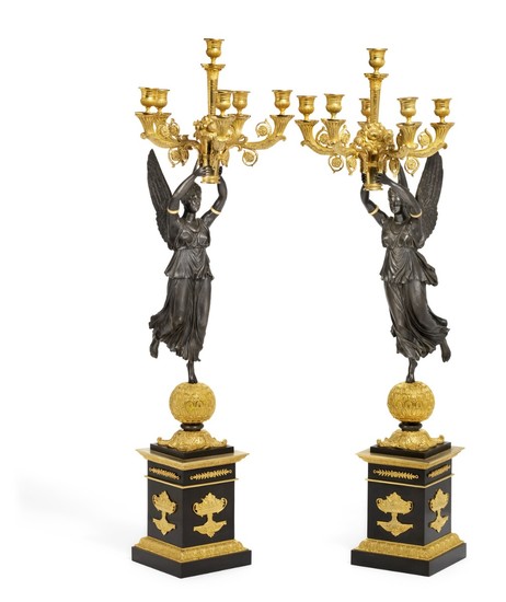 A pair of Empire style gilt and patinated bronze candelabra after model by Pierre-Philippe Thomire. France, 20th century. H. 103 cm. (2)