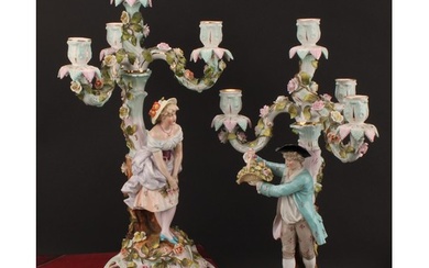 A pair of Sitzendorf figural four-light candelabra, modelled...