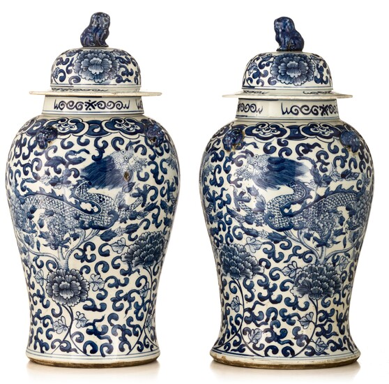 A pair of blue and white covered vases, finely decorated with dragons, 19th/20thC