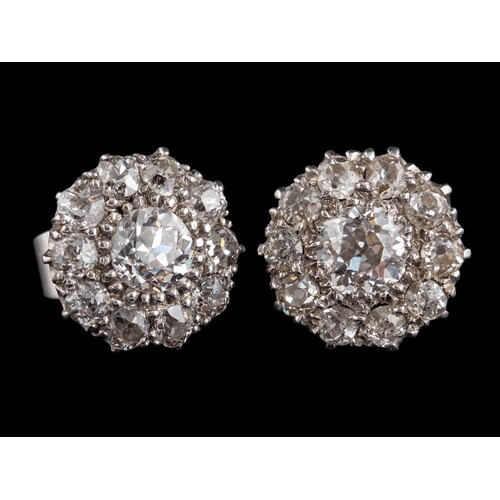 A pair of diamond cluster earrings,: the central old brillia...