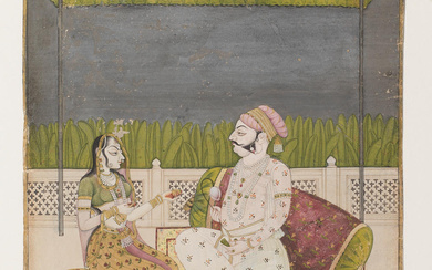 A prince and a lady, perhaps a courtesan, seated in...