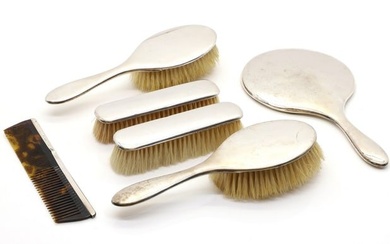 A silver mounted dressing table set