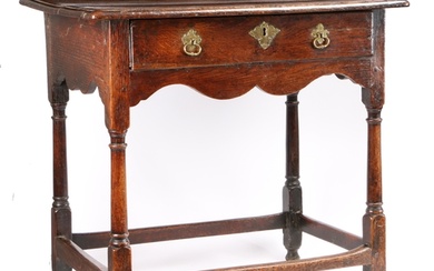 A small George I oak side table, circa 1720 The top of two...