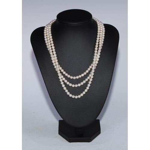 A three strand diamond and cultured pearl necklace, three un...