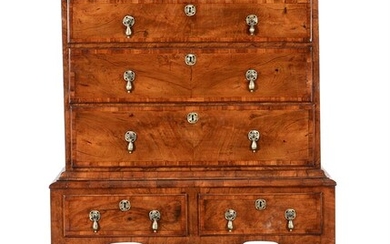 A walnut and crossbanded chest on stand