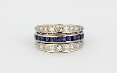 A white metal (tested 18ct gold) metamorphic ring set with square cut rubies and sapphires and brilliant cut diamonds, (O).