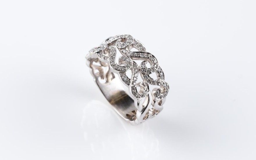AN 18CT WHITE GOLD DIAMOND RING; pierced scrolling design set with 92 round brilliant cut diamonds, size Q, wt. 7.85g.