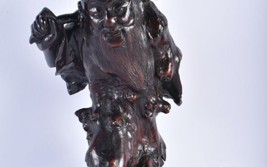 AN 18TH/19TH CENTURY CHINESE CARVED ROOTWOOD FIGURE OF AN IMMORTAL Qing. 33 cm high.
