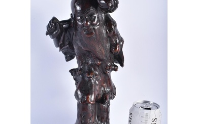 AN 18TH/19TH CENTURY CHINESE CARVED ROOTWOOD FIGURE OF AN IM...