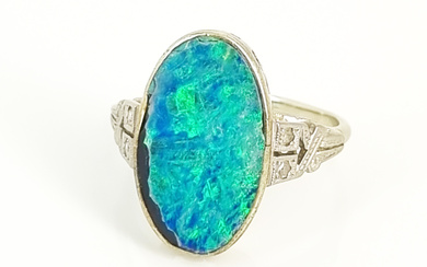 AN OPAL DOUBLET AND DIAMOND RING