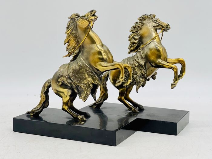 After Guillaume Cousteau - Pair of Horse Sculptures