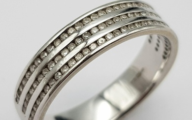 An 18K White Gold Triple Row Diamond Half Eternity Ring. 0.4...