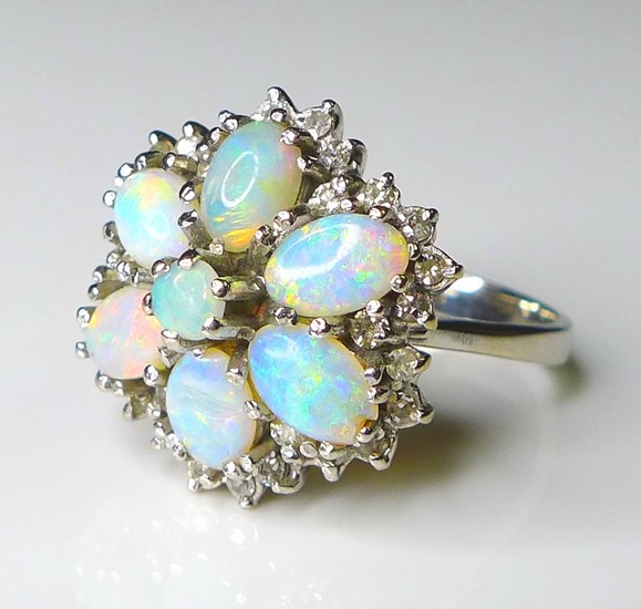 An 18ct white gold and opal dress ring, of flower head form,...
