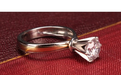 An 18ct white gold diamond solitaire ring, the round brillia...