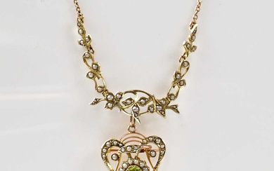 An Edwardian 9ct gold necklace set with seed pearls on...