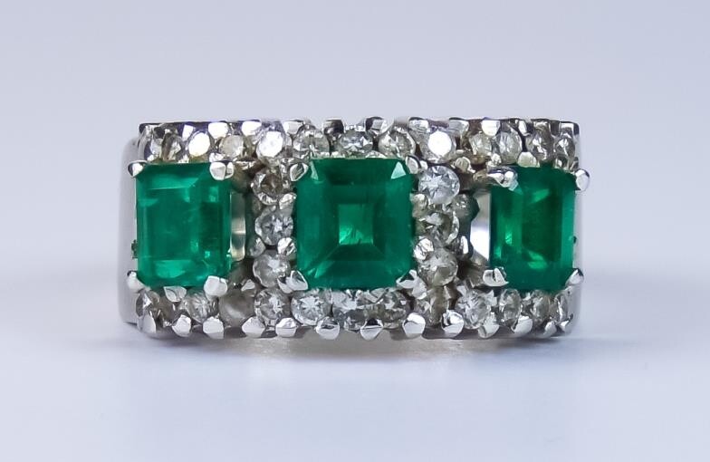An Emerald and Diamond Ring, Modern, 18ct gold set...