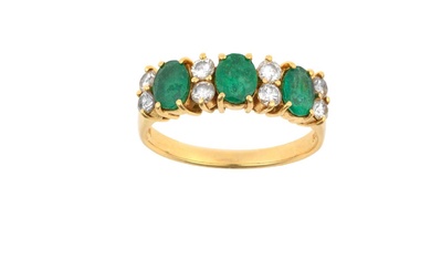 An Emerald and Diamond Ring three oval cut emeralds spaced...