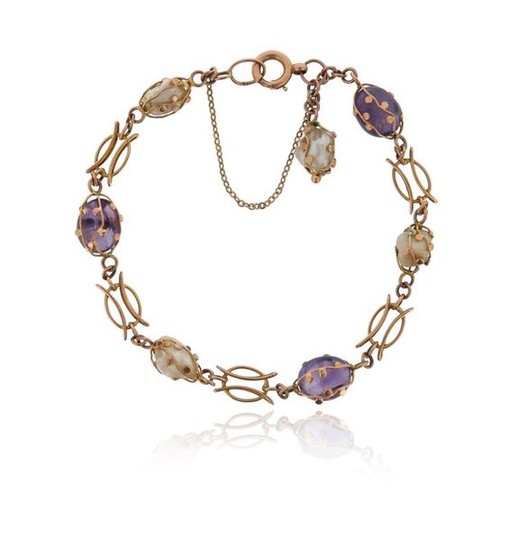 An amethyst and freshwater pearl bracelet, set with...