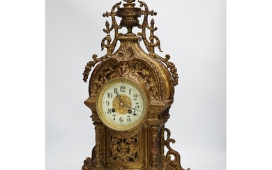 An ornately cast French bronze mantel clock, 57cm high...