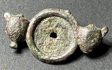 Ancient Roman Bronze Rarer Subtype of Brooch with a Heads of small calves surrounding a central disc, With an Austrian