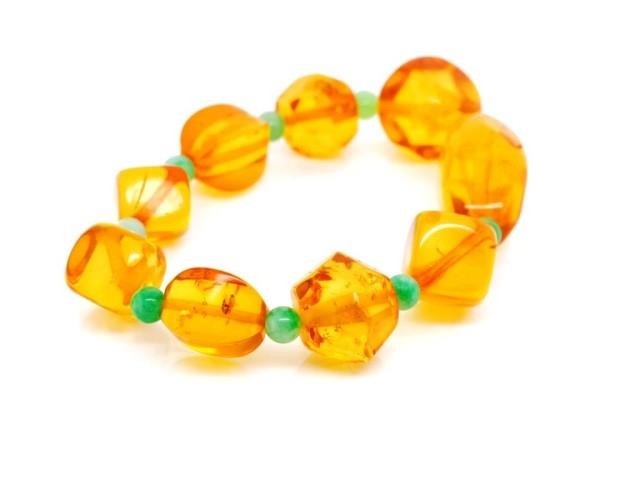 Baltic honey amber beaded bracelet with green jadeite beads....