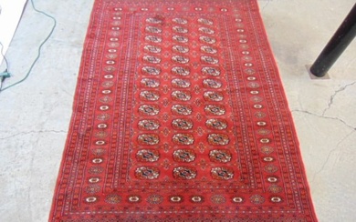 Bokhara carpet, in red, rug is 73" by 50.5"