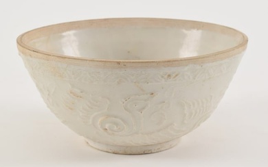 Chinese Song dynasty white glaze molded bowl with phoenix bird decoration. 2 inch tight line crack.