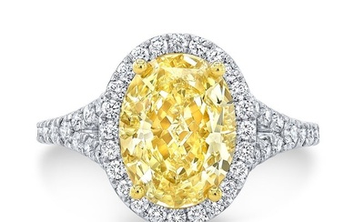 Fancy Yellow Oval Diamond With Pave Diamond Halo And Shank In 18k Two Tone Gold