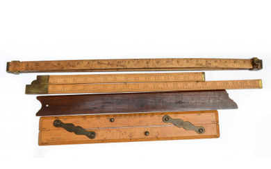 Four wooden rulers