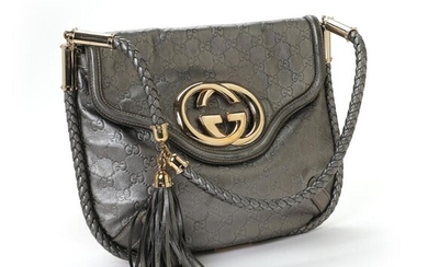 Gucci: A bag of grey metallic monogram leather with gold tone hardware, handle and one compartment with a button closure. – Bruun Rasmussen Auctioneers of Fine Art