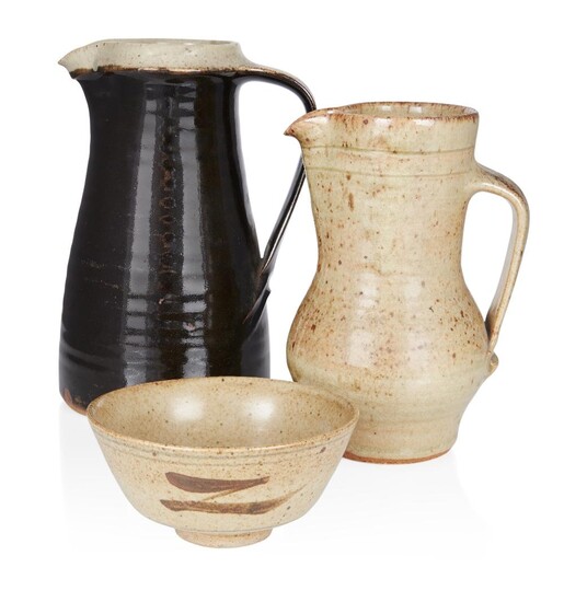 Leach Pottery group, 'Z' bowl, celadon jug with brown speckles, and dark brown glaze jug with buff rim (3), mid to late 20th century, Glazed stoneware, Each impressed with Leach Pottery seal, Bowl: 13.5cm diameter, 6cm high. Celadon jug: 20cm high...