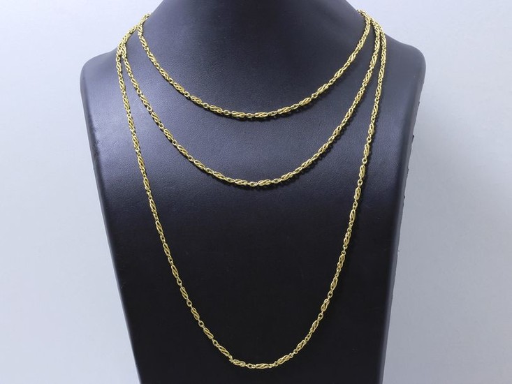 Long necklace in 750 thousandths gold, fancy stitch,...