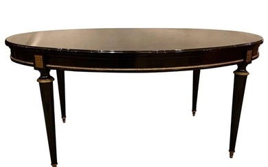 Louis XVI Jansen style center or dining table in a black lacquer Recent Steinway piano finish.