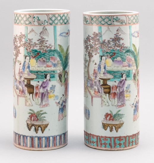 PAIR OF CHINESE FAMILLE ROSE PORCELAIN HAT STANDS With enameled decoration of figures enjoying various pursuits in a courtyard lands...