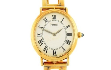 PIAGET - a Classic Lady bangle watch. Yellow metal case, stamped 750. Case width 24mm. Reference