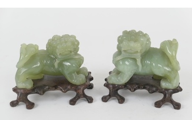 Pair of Chinese carved celadon green jade Kylins, 20th Centu...
