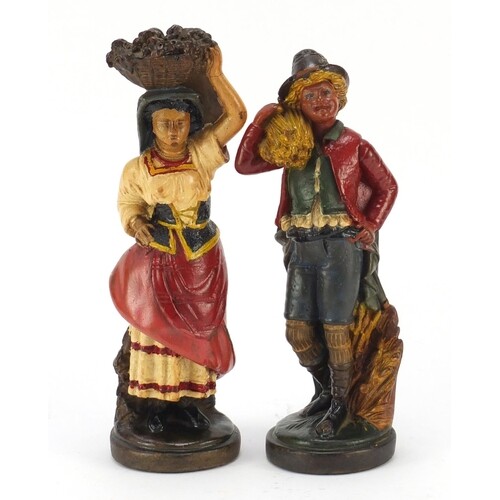 Pair of hand painted plaster figures of farmers, the largest...