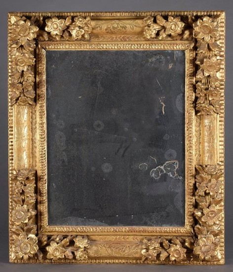 Rectangular mirror, the carved and gilded wood casing,...