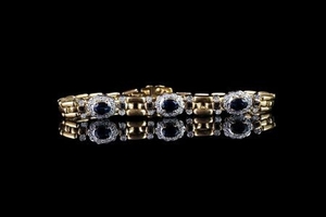 Sapphire and diamond bracelet, 3 sapphires, 4 claw set, each surrounded by 10 diamonds, 6 sapphires in a rubover setting,...