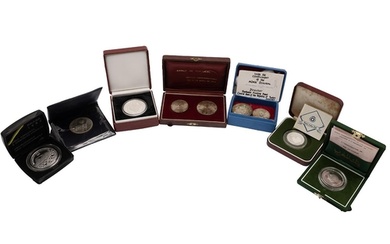Seven (7) silver world coins and sets in presentation packag...