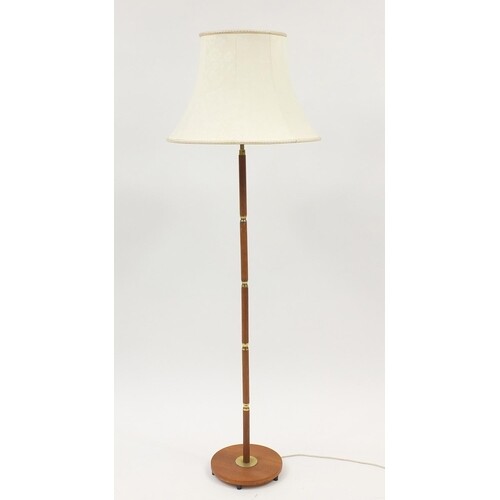 Teak and brass standard lamp with shade, 154cm high