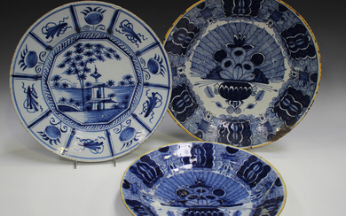 Three Dutch Delft chargers, mid to late 18th century, comprising one painted with a chinoiserie land